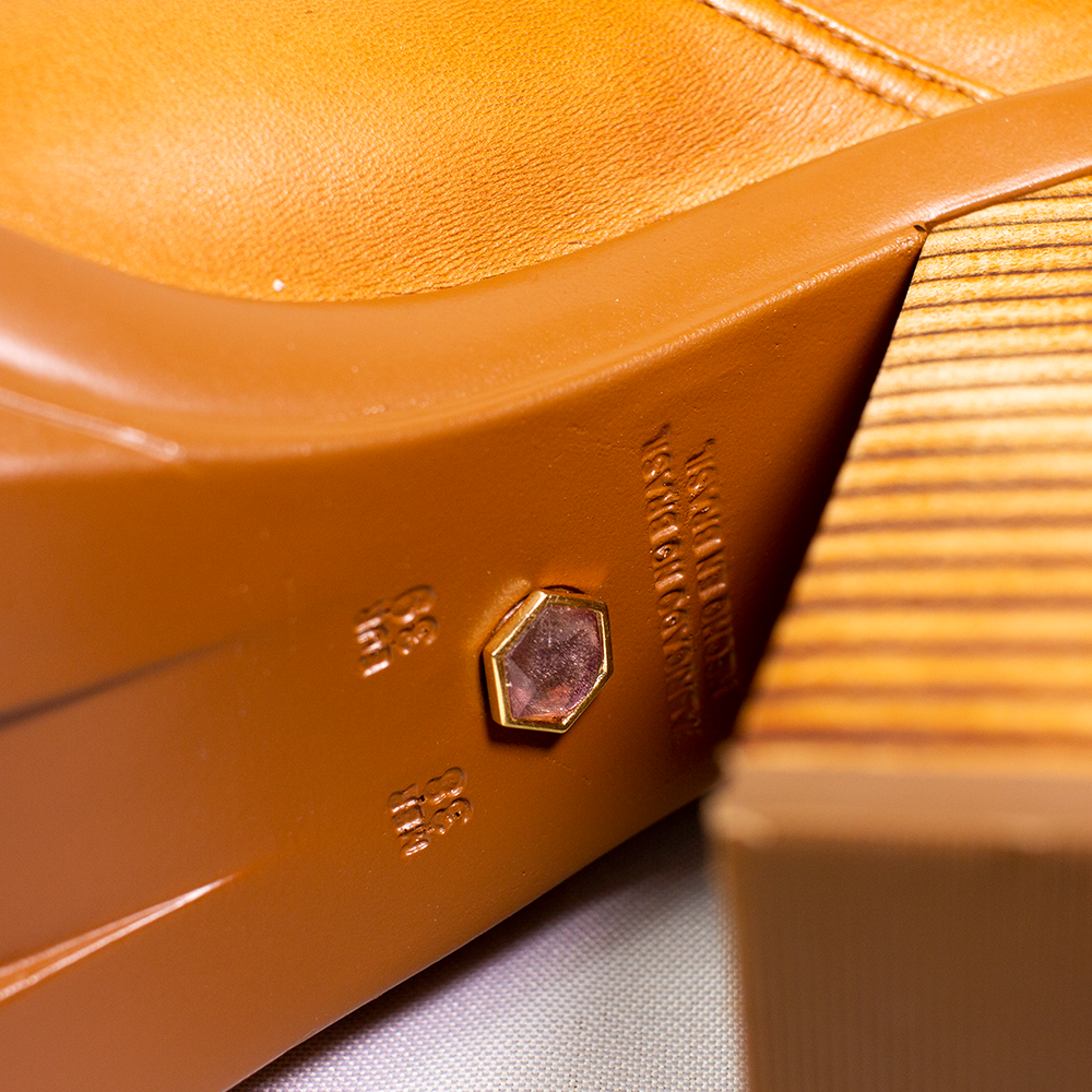 Amethyst Stone Embedded In A Pari Of Women's Boots